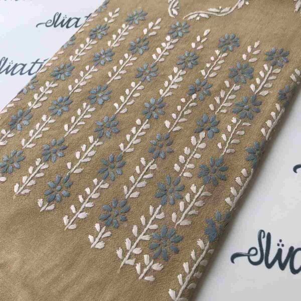 Women's wool shawl with intricate hand embroidery, featuring a warm biscuit color, perfect for winter styling