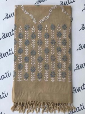 Women's wool shawl with intricate hand embroidery, featuring a warm biscuit color, perfect for winter styling