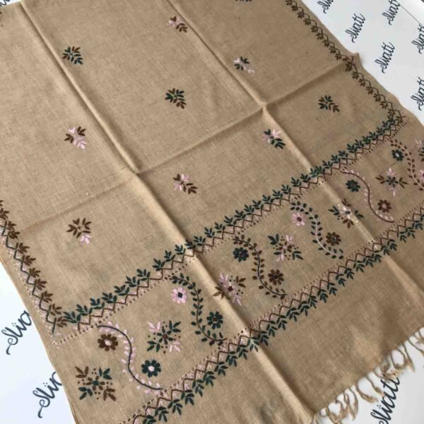 Light-colored shawl featuring intricate Taar Kashi hand embroidery, offering warmth and elegance for winter wear