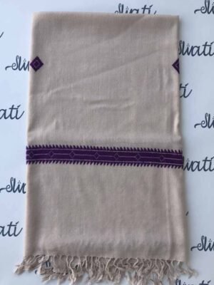"Handcrafted light-colored Swati wool shawl featuring delicate blue flower embroidery, a perfect blend of warmth, elegance, and traditional craftsmanship for winter wear.